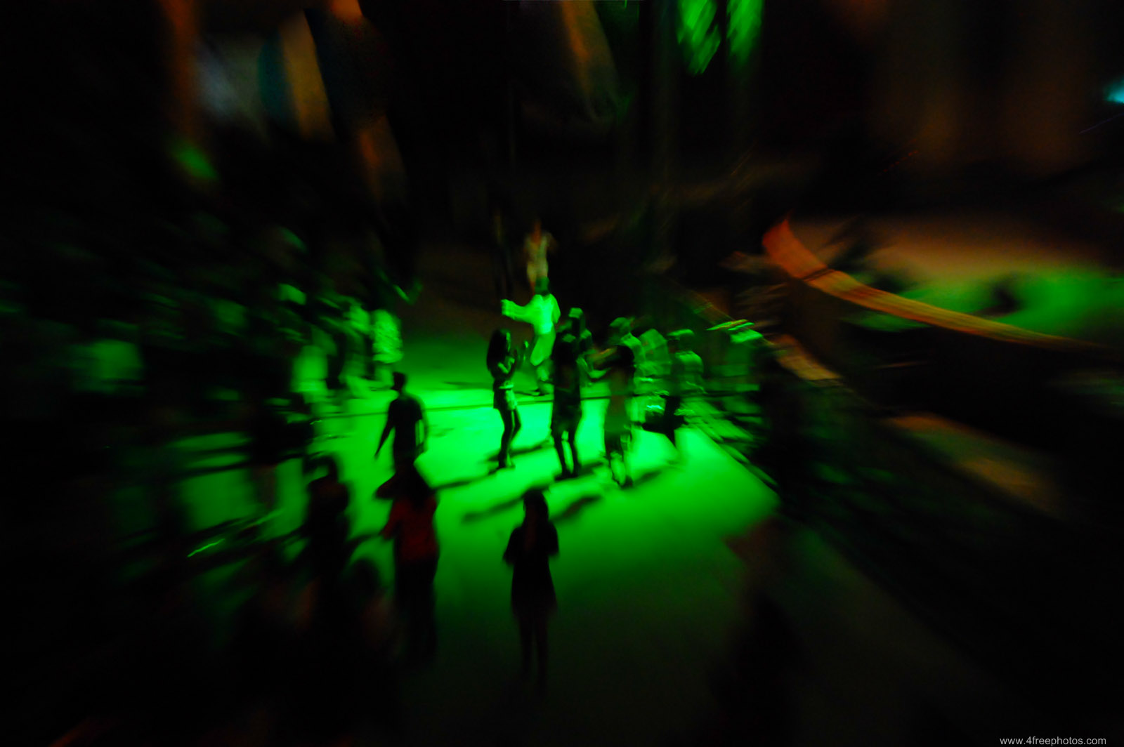 People dancing at a concert near stage